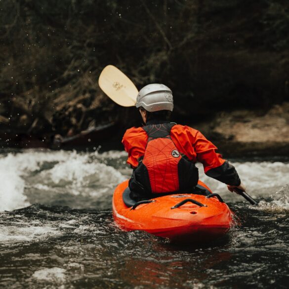 Image of a person whitewater kayaking